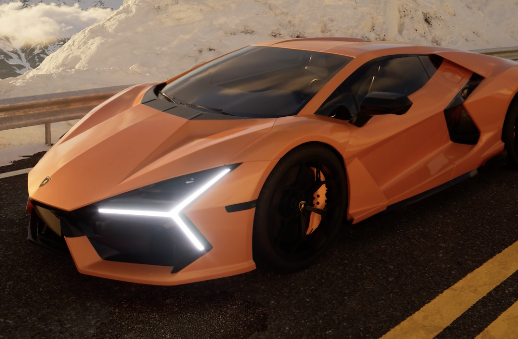 Orange sports car on a snowy mountain road